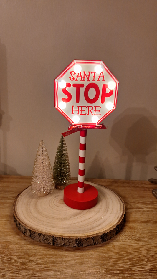 Light up Santa stop here sign